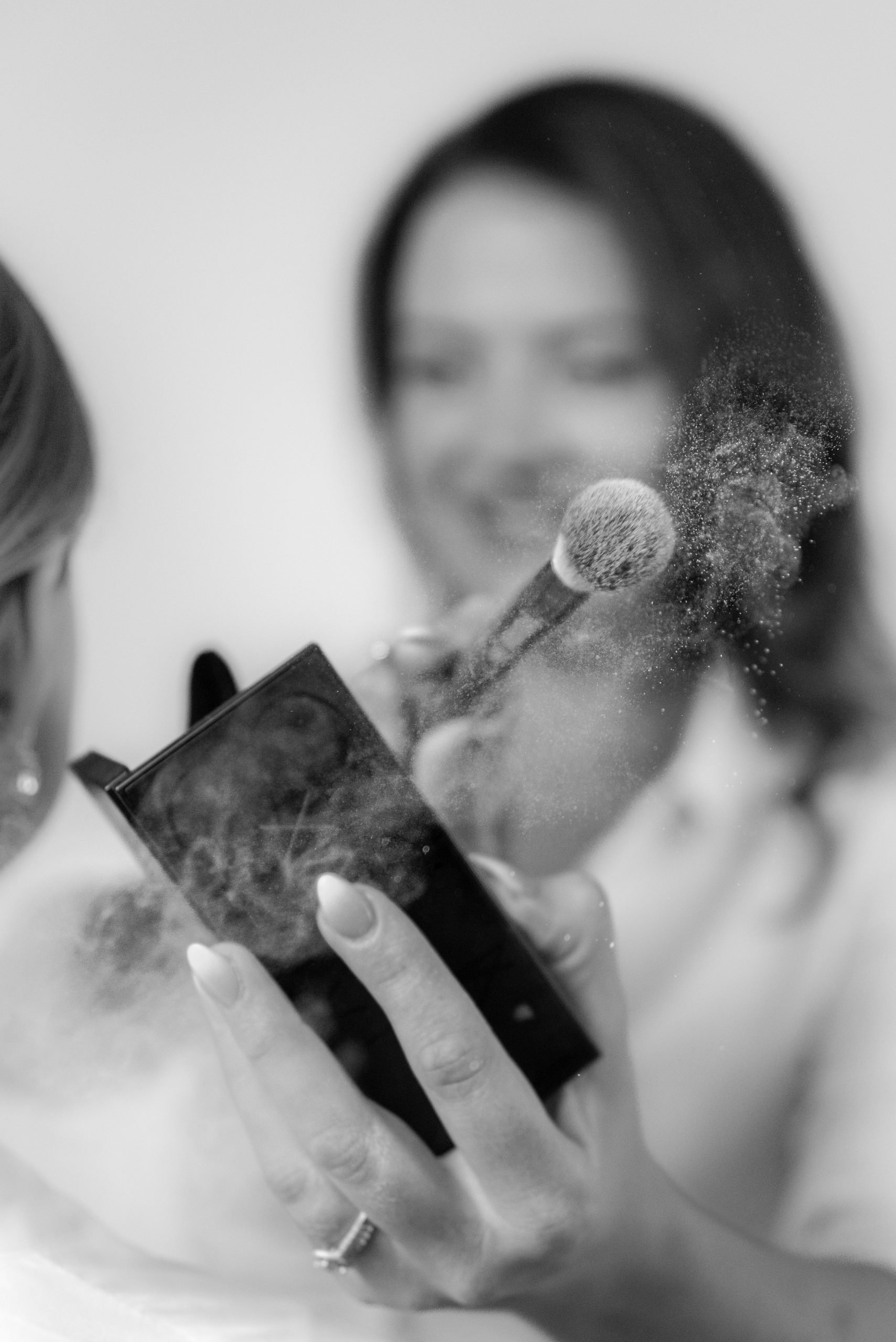 Makeup brush and powder in black and white