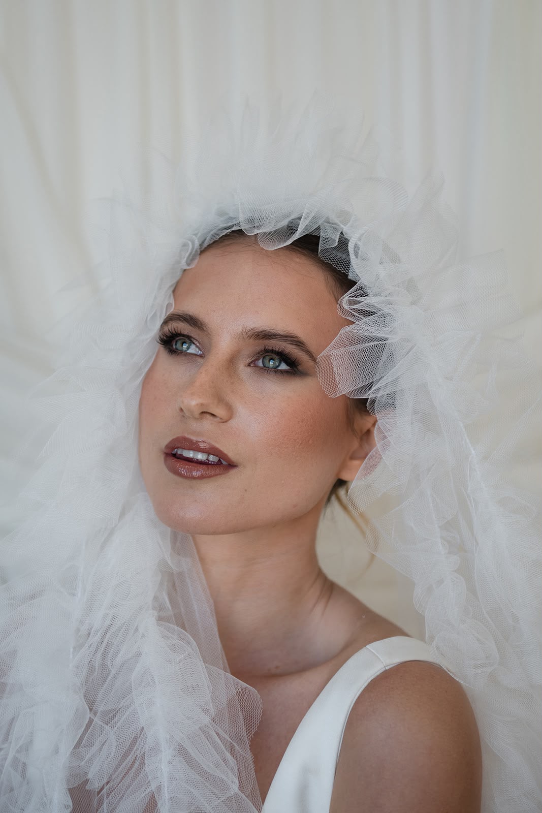 Editorial bridal makeup with tulle veil