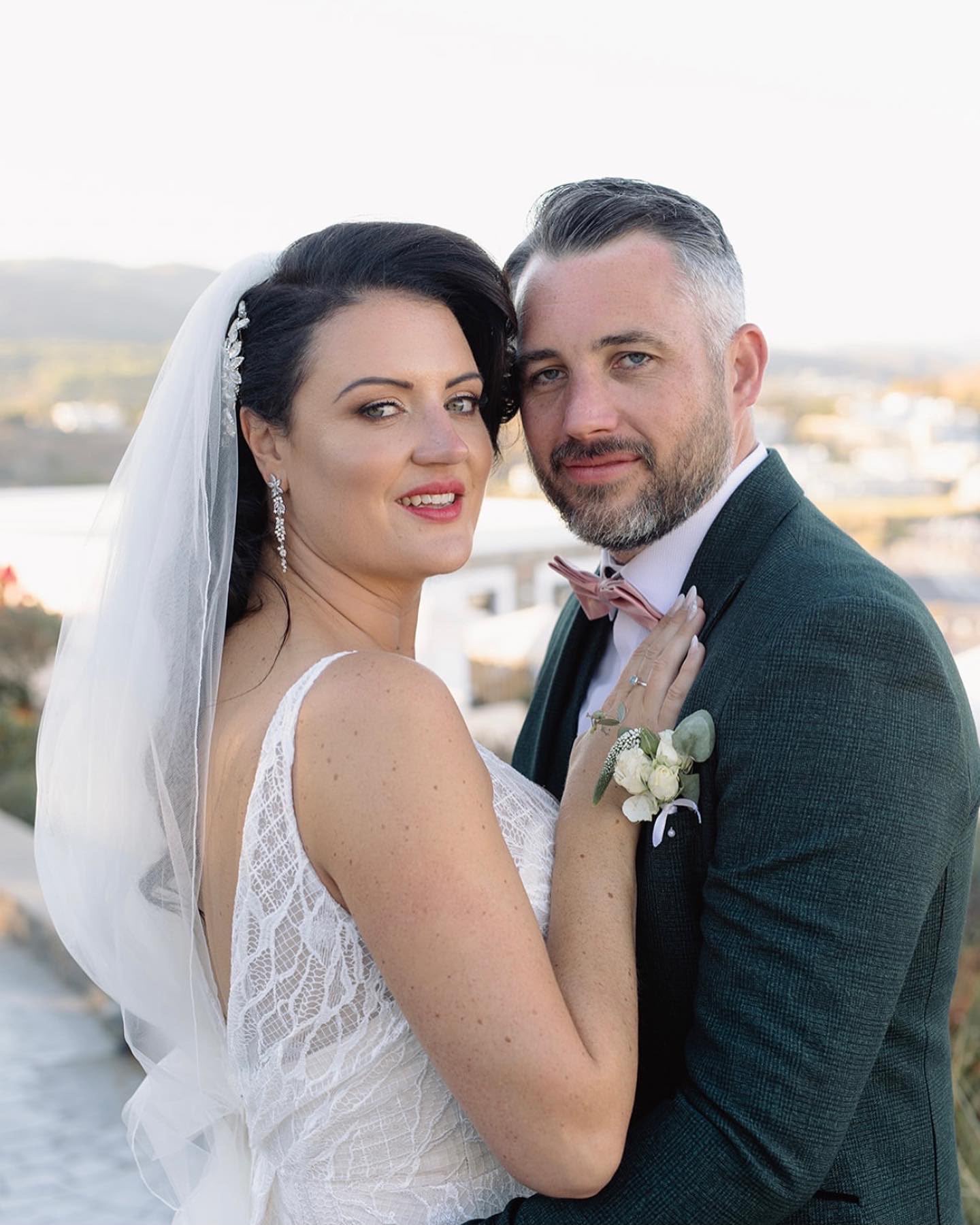 Becky and her husband on their wedding day in Lindos, Greece